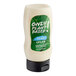 A white plastic bottle of Only Plant Based Vegan Sour Cream with a green label containing white liquid.