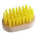 A Fox Run wooden brush with yellow bristles.