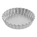 A silver Fox Run round fluted tart pan.