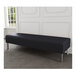 A Lesro Luxe Lounge black vinyl bench with steel legs in a room.