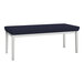 A Lesro Lenox navy fabric bench with steel legs.