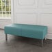 A blue Lesro Luxe Lounge 2-seat bench with steel legs.