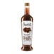 A bottle of Amoretti Chocolate Craft Puree with chocolate syrup inside.