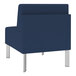 A Lesro Luxe Lounge series blue vinyl guest chair with steel legs.