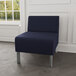 A Lesro Luxe Lounge navy fabric guest chair with steel legs.