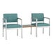 Two blue Lesro Lenox chairs with a table.