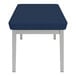 A Lesro Lenox steel bench with blue vinyl cushions.