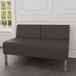 A charcoal Lesro Luxe Loveseat in a lounge room with steel legs.