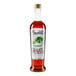 A bottle of Amoretti Woodruff Craft Puree with a white label.