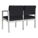 A black Lesro Lenox steel loveseat with a center arm.