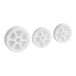 A group of white plastic gears with a hole in the center.