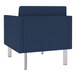 A Lesro Luxe Lounge blue vinyl armchair with steel legs.