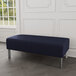 A Lesro Luxe navy blue bench with steel legs.