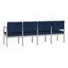 A row of Lesro Lenox blue vinyl sofas with center arms.