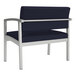 A navy blue Lesro Lenox bariatric guest chair with silver metal legs.