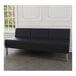 A black vinyl Lesro Luxe Lounge sofa with steel legs in a lounge area.