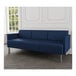 A Lesro Luxe Lounge sofa with blue vinyl upholstery and steel legs in a room with a white wall.