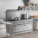 A large stainless steel Cooking Performance Group range in a professional kitchen.