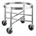 A stainless steel round dolly with black wheels.