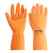 A close-up of an orange Cordova neoprene/latex rubber glove with flock lining.