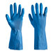 A hand wearing a blue Cordova latex rubber glove.