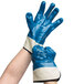 A pair of blue and white Cordova Brawler Smooth Supported Nitrile Gloves with Jersey Lining.