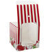 A white Baker's Lane candy apple box with red and white stripes and apples on it.