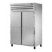 A True Manufacturing white reach-in freezer with two solid doors.