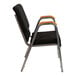 A black Flash Furniture church chair with a silver metal frame and wood accents.