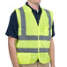 A man wearing a yellow Cordova safety vest.