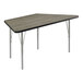 A trapezoid activity table with a grey top and black trim on silver legs.