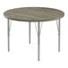 A Correll round activity table with metal legs and a gray driftwood top.