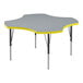 A gray high-pressure laminate activity table with yellow trim on the edge and black legs.