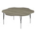 A Correll activity table with a wood surface and black legs with driftwood trim.