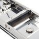 A metal cutting blade for a Bron Coucke mandoline.