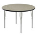 A round Correll activity table with black T-molded edges and silver legs.