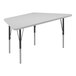 A white trapezoid activity table with black metal legs.