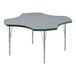 A Correll activity table with a gray and green clover-shaped top and silver legs.