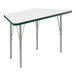 A white trapezoid activity table with silver legs and green edge.