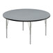 A round Correll activity table with a gray granite top and silver legs.