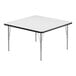 A white square Correll activity table with silver legs and black edge.