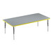 A grey rectangular table with yellow trim.