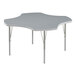 A gray table with a white star-shaped top and silver legs.