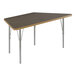 A trapezoid activity table with silver legs and a walnut top.