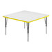 A white square activity table with yellow trim.