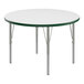 A white round Correll activity table with green T-Mold and silver legs.