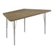 A trapezoid activity table with silver legs and a hickory wood surface.