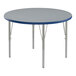 A round Correll activity table with a blue T-Mold and metal legs.