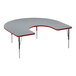 A gray high-pressure laminate horseshoe activity table with black metal legs and red trim.