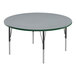 A round gray Correll activity table with black legs and green edge.